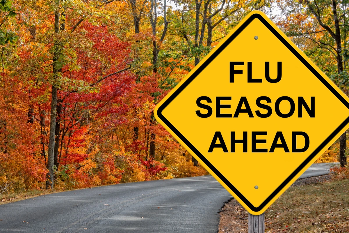 Flu season ahead sign on a fall road